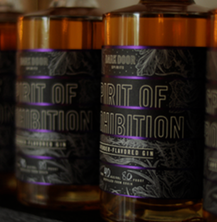 Dark Door Spirits Spirit of Prohibition Gin bottle showcasing honey color and herbal design, 80 proof gin aroma and flavor.