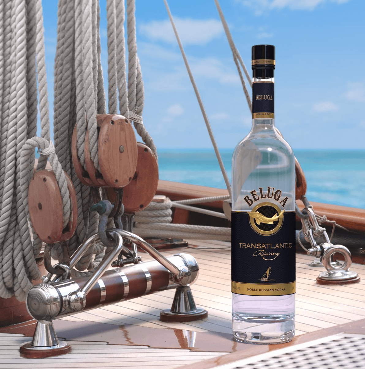 Beluga Transatlantic Racing vodka on a yacht deck with ocean in background, celebrating yachting achievements.