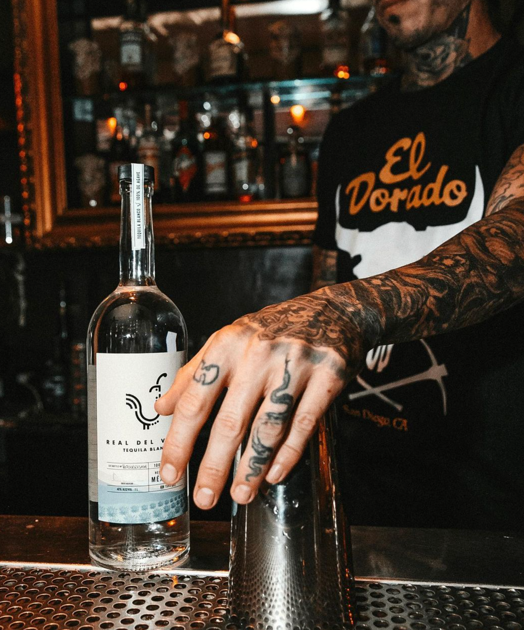 Bartender serving Real Del Valle Blanco Tequila, a crystalline and smooth additive-free tequila with citrus notes.
