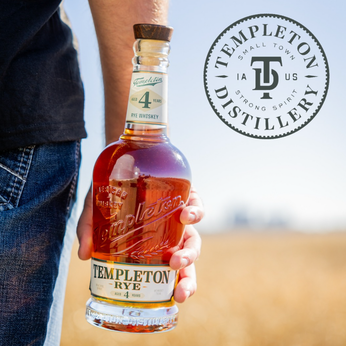 Bottle of Templeton Rye 4 Year whiskey held in hand, showcasing its smooth, spicy flavor and distillery logo.