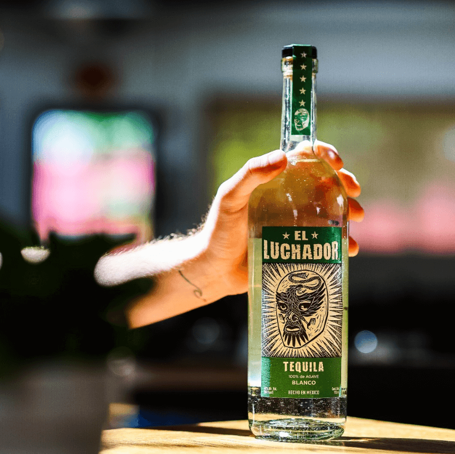 El Luchador Blanco tequila bottle showcasing fresh agave and citrus flavors, ideal for cocktails and sipping.