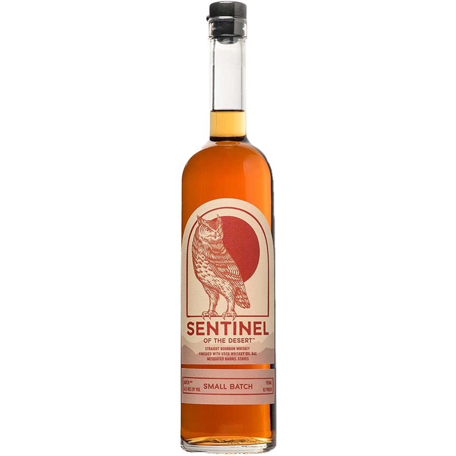 Bottle of Sentinel Bourbon of the Desert showcasing its unique label and amber color.