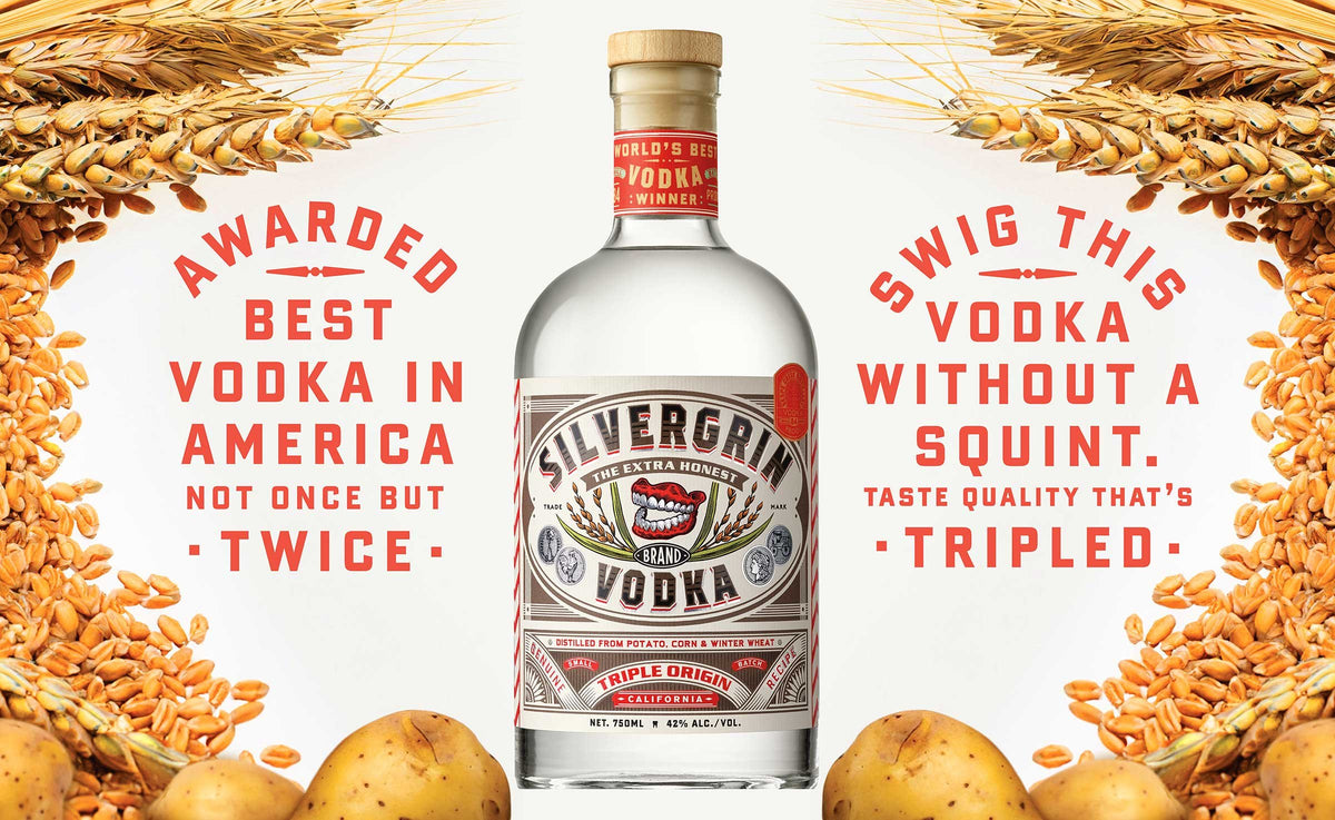 Silvergrin Triple Origin Vodka bottle surrounded by wheat and potatoes, highlighting its award-winning quality.
