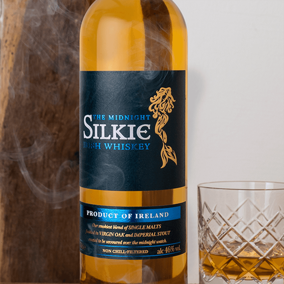 Bottle of Sliabh Liag The Midnight Silkie Irish Whiskey with glass, showcasing its rich amber color and smoky blend.