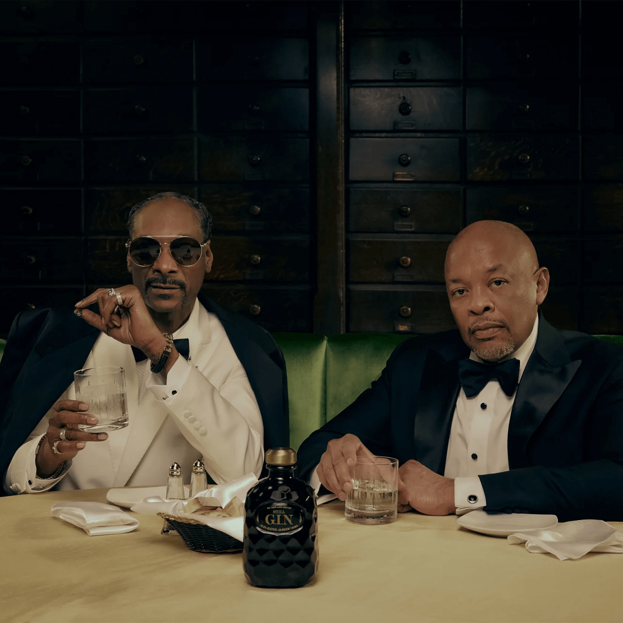 Still G.I.N. by Dre & Snoop Gin with Dr. Dre and Snoop Dogg at an elegant setting.