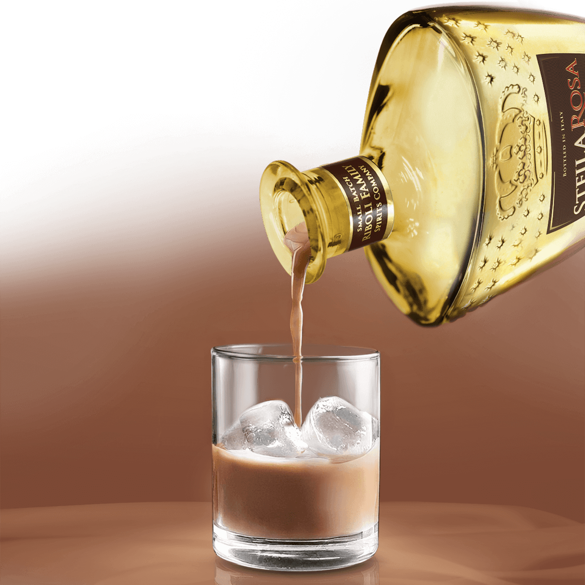 Pouring Stella Rosa Chocolate Hazelnut Cream Liqueur over ice in a glass, showcasing its rich and creamy texture.