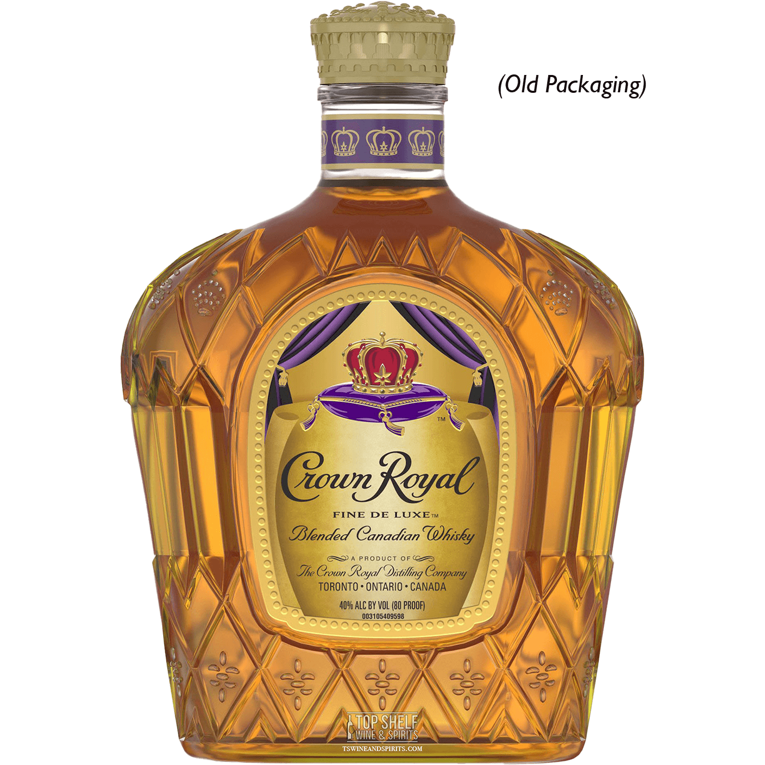 Crown Royal Deluxe Canadian Whisky bottle in old packaging with a royal design and rich amber liquid.