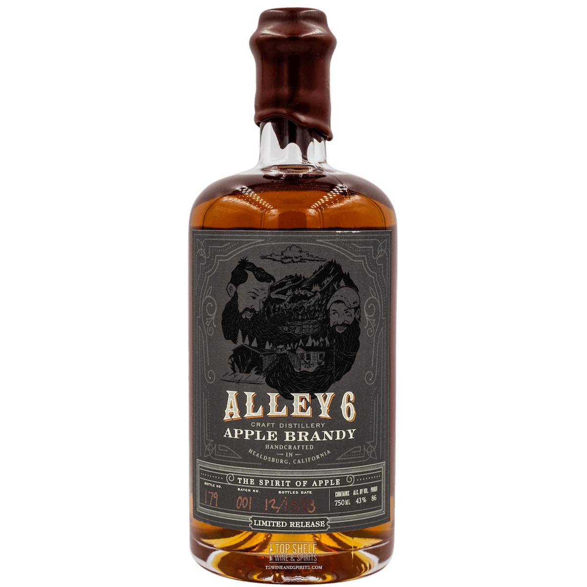 Alley 6 Apple Brandy bottle, featuring a rich amber color and a vintage label highlighting ciders and oak aging.
