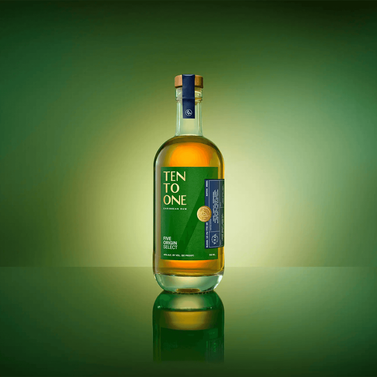 Bottle of Ten To One Five Origin Select Rum against a vibrant green backdrop, showcasing its premium blend.