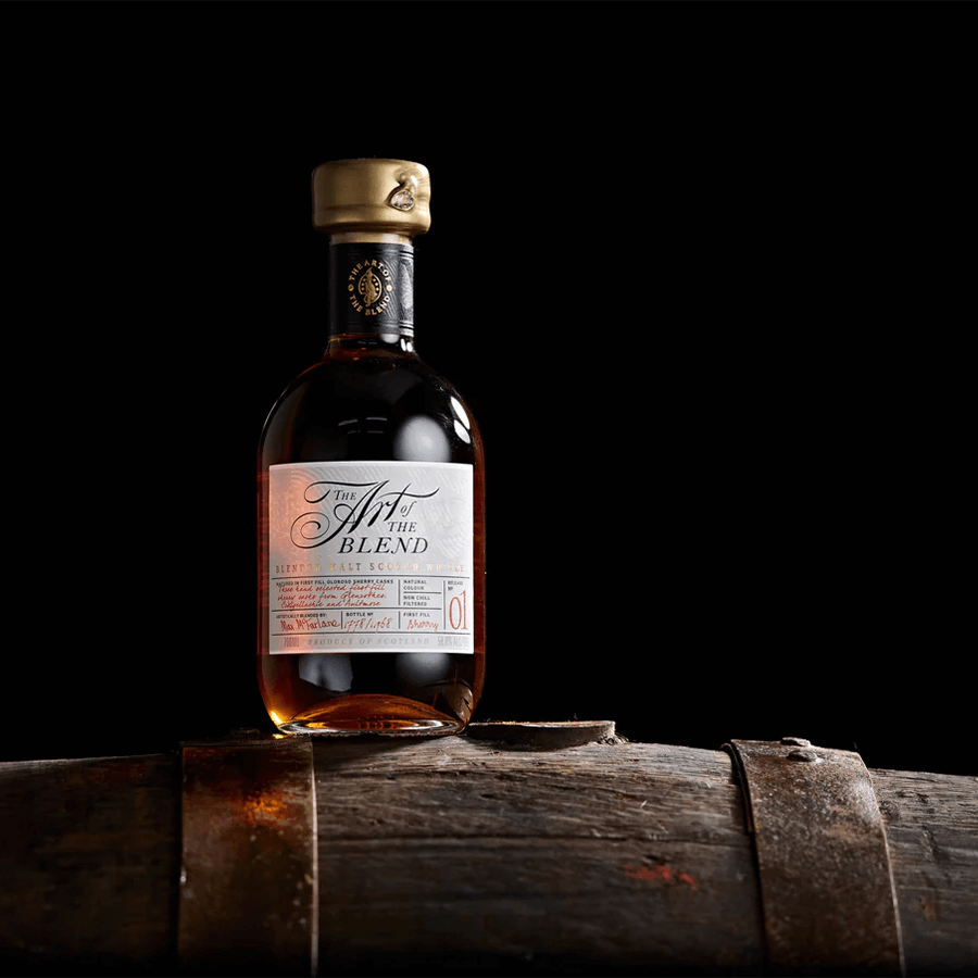 The Art Of The Blend No. 1 Scotch Whisky 700ml on a wooden barrel, showcasing its rich color and elegant design.
