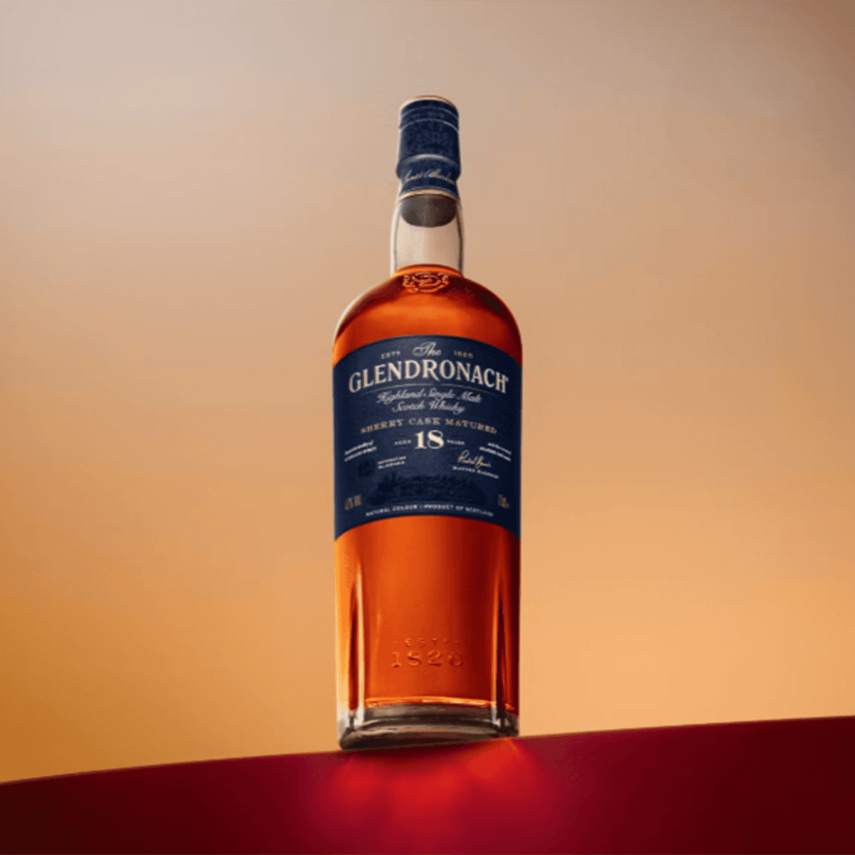 Bottle of The Glendronach Sherry Cask 18 Year Scotch, showcasing rich amber color and elegant labeling.