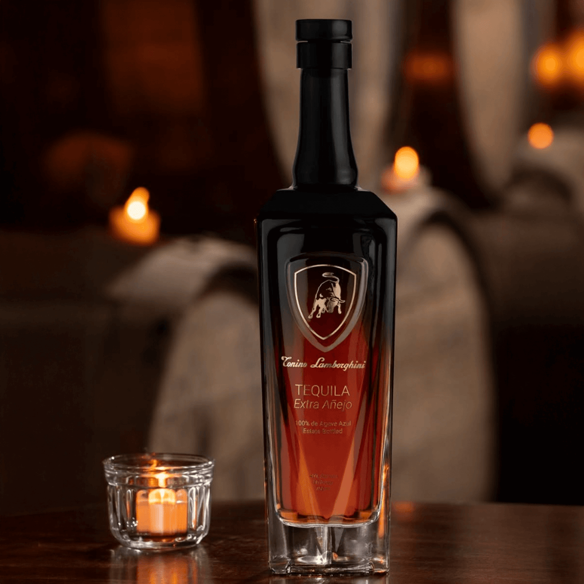 Tonino Lamborghini Extra Añejo Tequila bottle on wooden table with candlelight, showcasing premium craftsmanship and elegance.