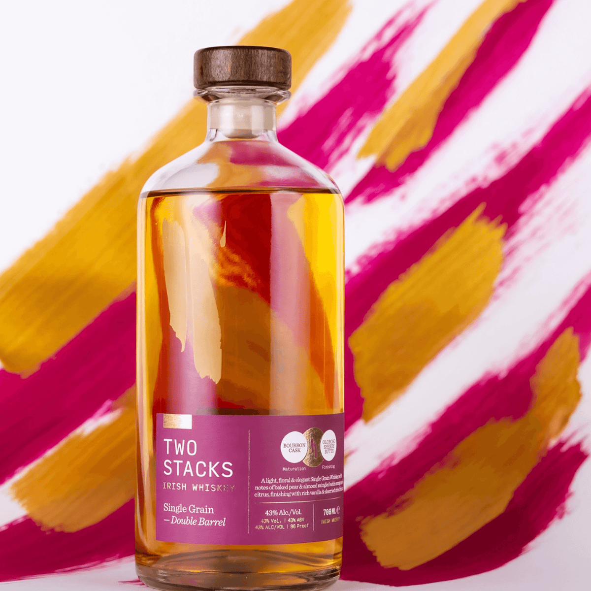 Bottle of Two Stacks Single Grain Double Barrel Irish Whiskey showcasing its floral, elegant character against a vibrant background.