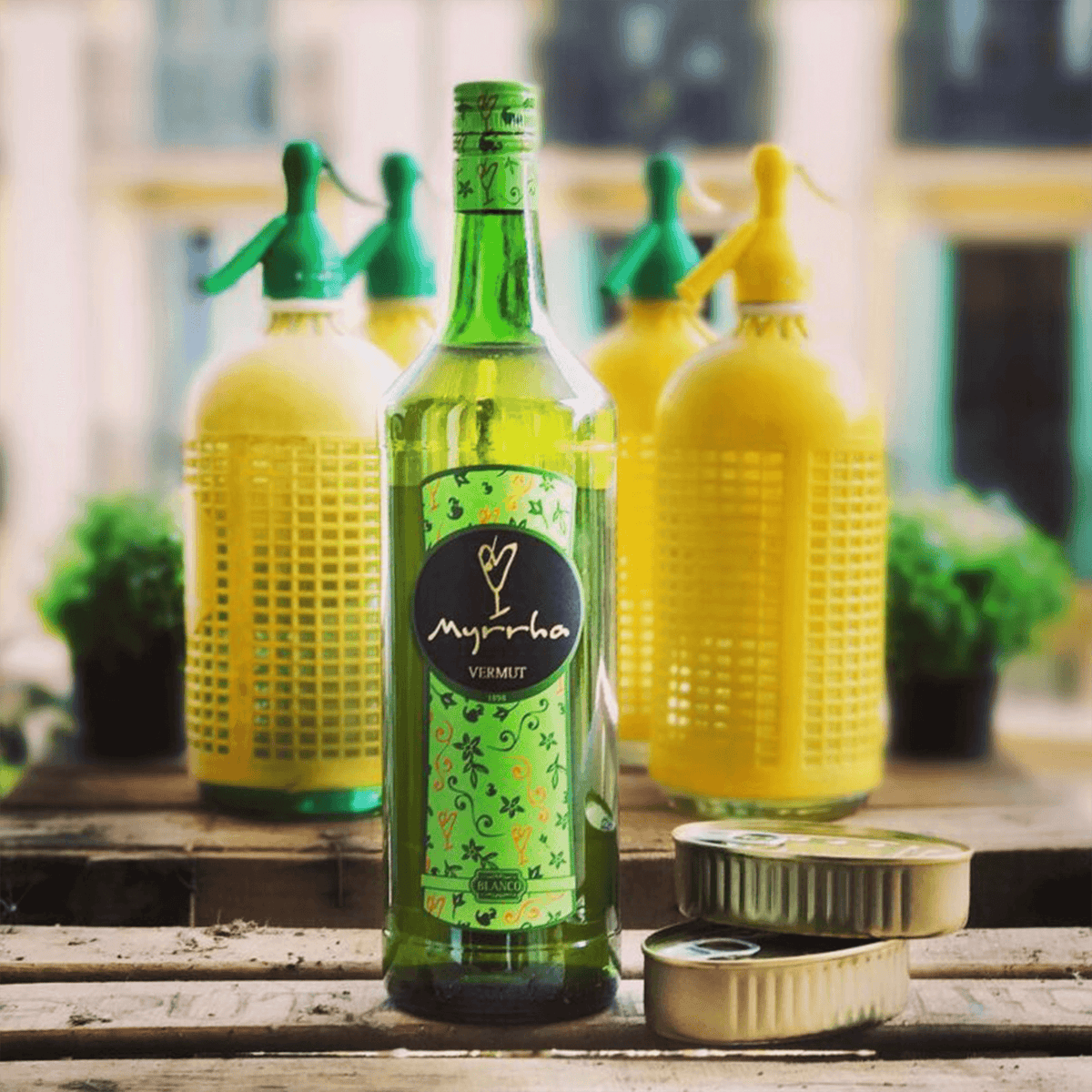 Vermut Padró & Co. Myrrha Blanco 1L bottle with yellow and green background, showcasing its vibrant design and unique flavor.