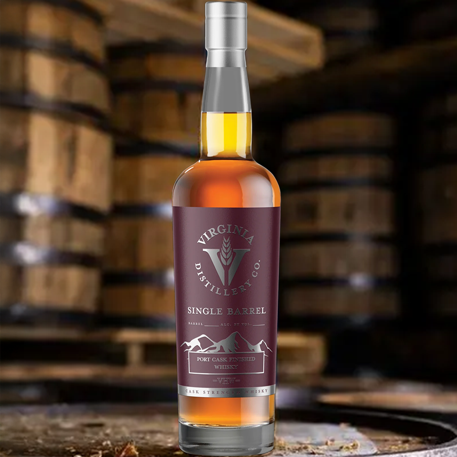 Virginia Distillery Co. Single Barrel Port Cask Finished Whiskey bottle surrounded by aging barrels.