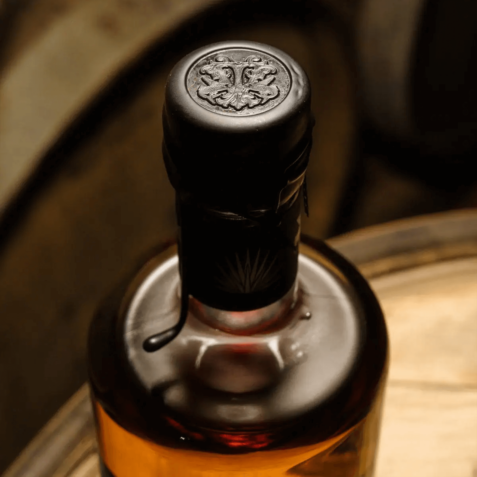 Top view of Volans 7 Year Extra Añejo Tequila bottle showcasing its elegant cap and rich amber liquid.