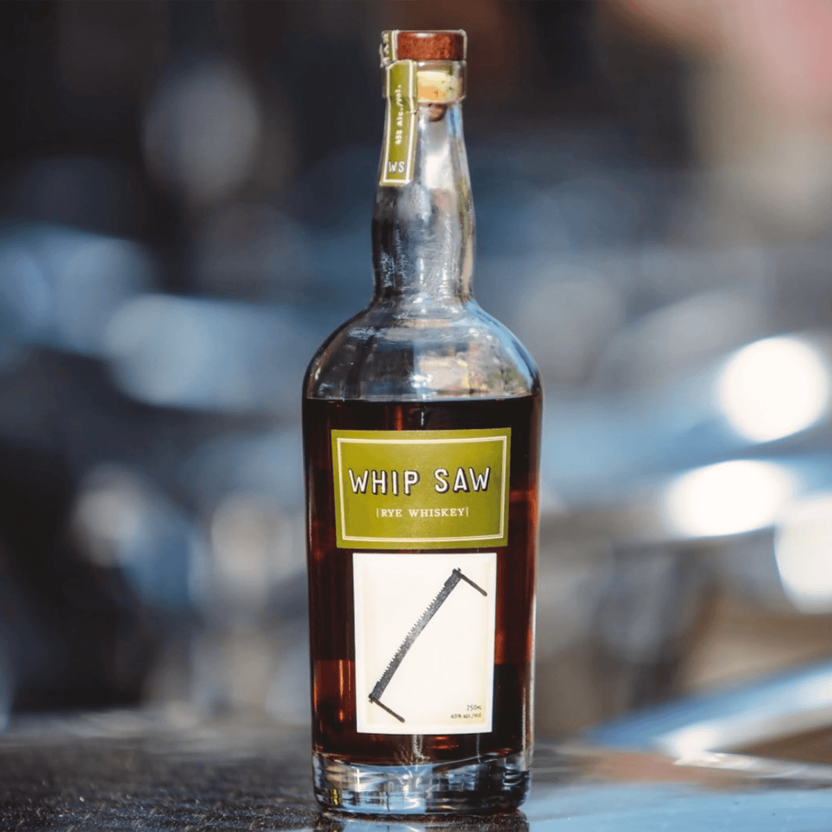 Whip Saw Rye Whiskey bottle showcasing its bold character and smooth finish in a refined setting.