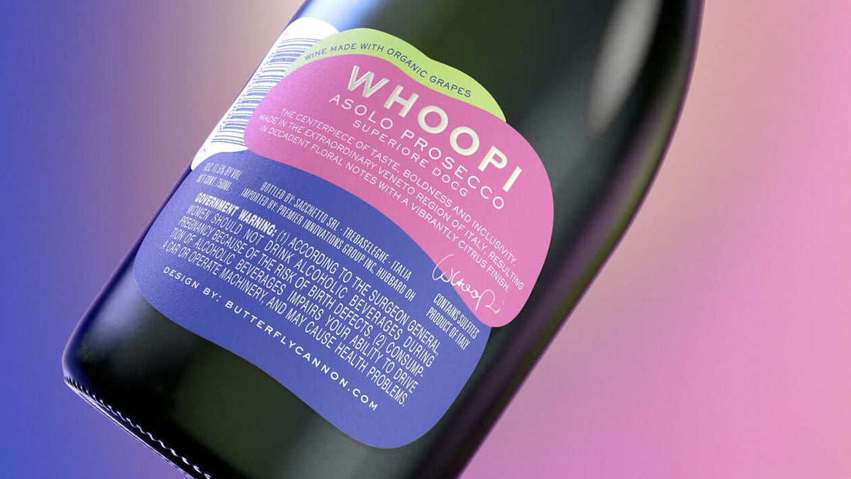 Label of Whoopi Goldberg Prosecco, featuring elegant design and organic grape details.