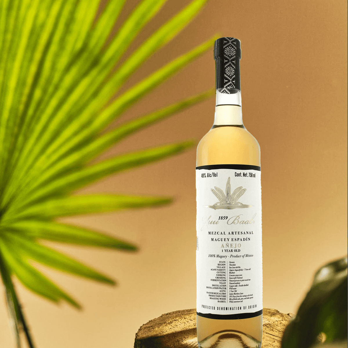 Yuu Baal Mezcal Añejo bottle showcasing artisanal craftsmanship, 100% agave, and rich golden hue.
