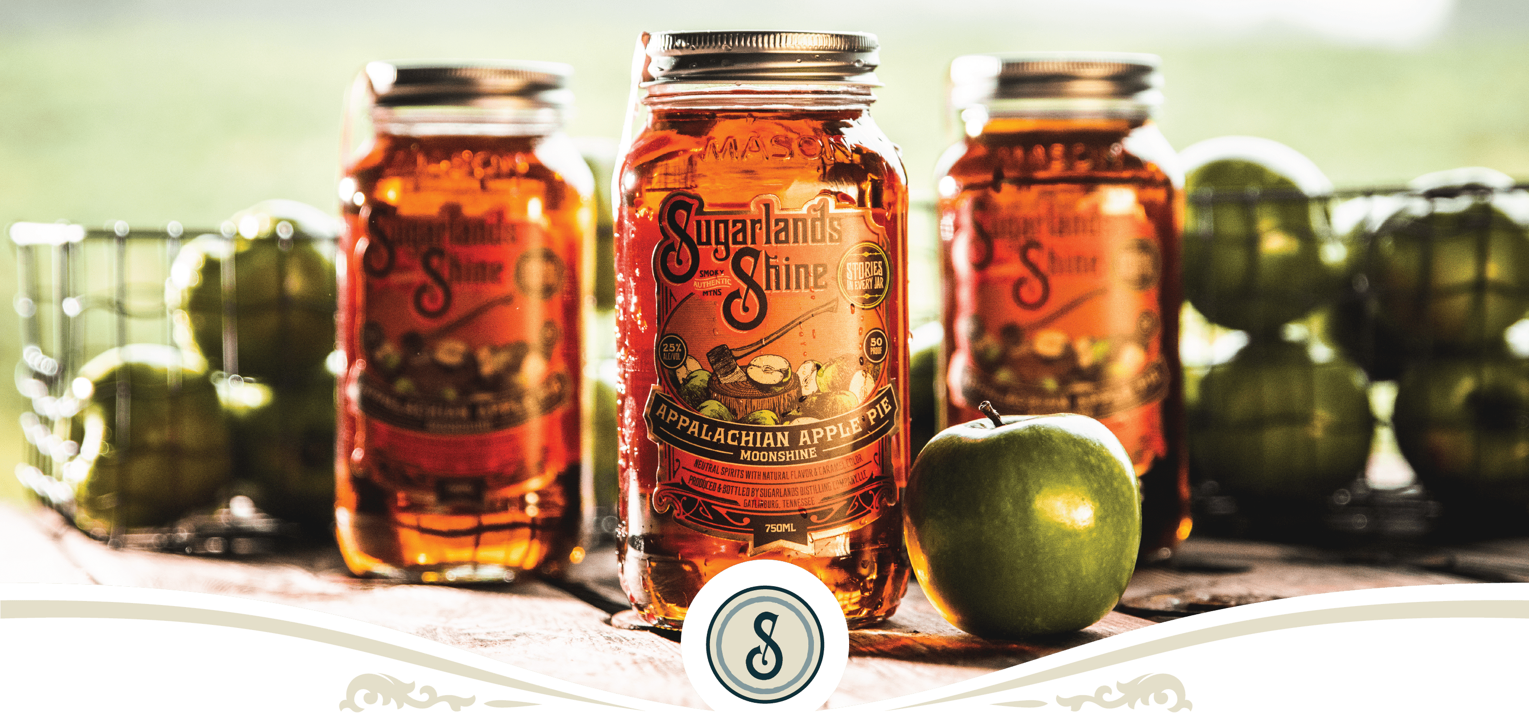 Sugarlands Shine Appalachian Apple Pie Moonshine with fresh green apples in the Smoky Mountains.