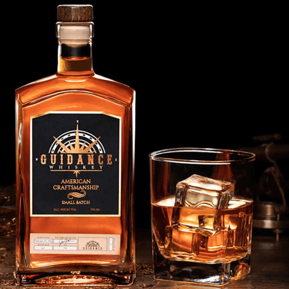 Guidance Small Batch Whiskey bottle with a glass of whiskey, highlighting American craftsmanship and rich flavors.
