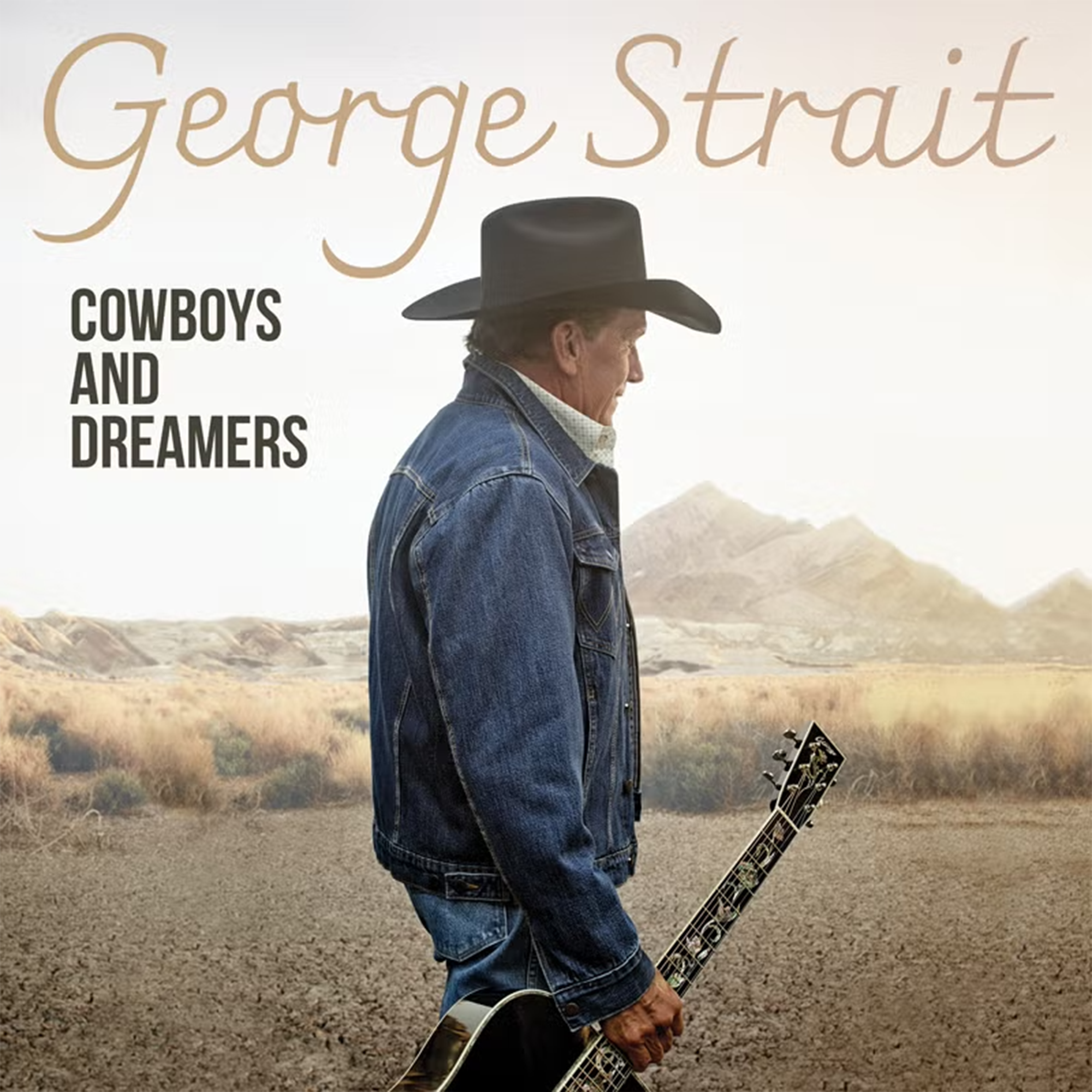 George Strait in cowboy hat with guitar, promoting his album 'Cowboys and Dreamers'.