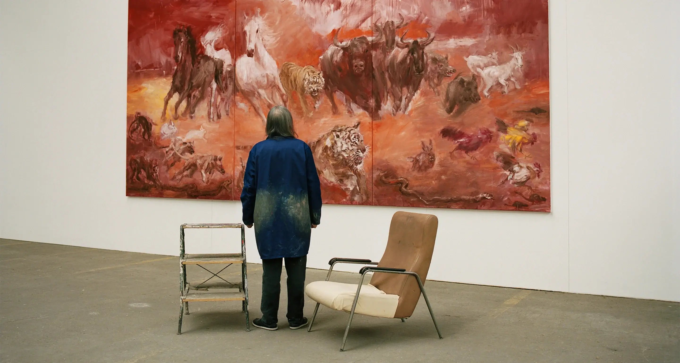 Artist Yan Pei-Ming stands before his monumental painting celebrating the 2023 Lunar New Year and the Zodiac.