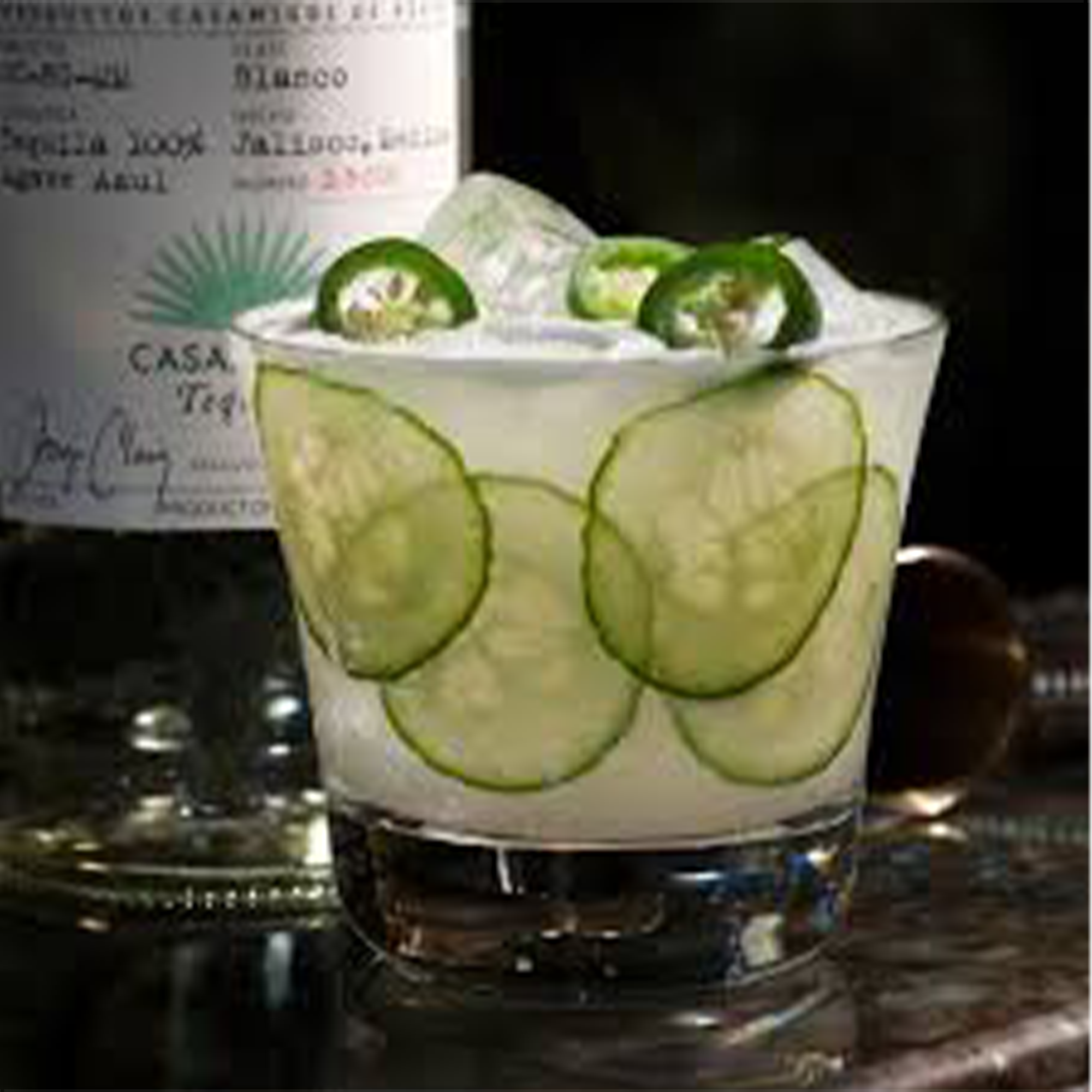 Casamigos Jalapeño Blanco Tequila cocktail served with cucumber and jalapeño slices in an elegant glass.