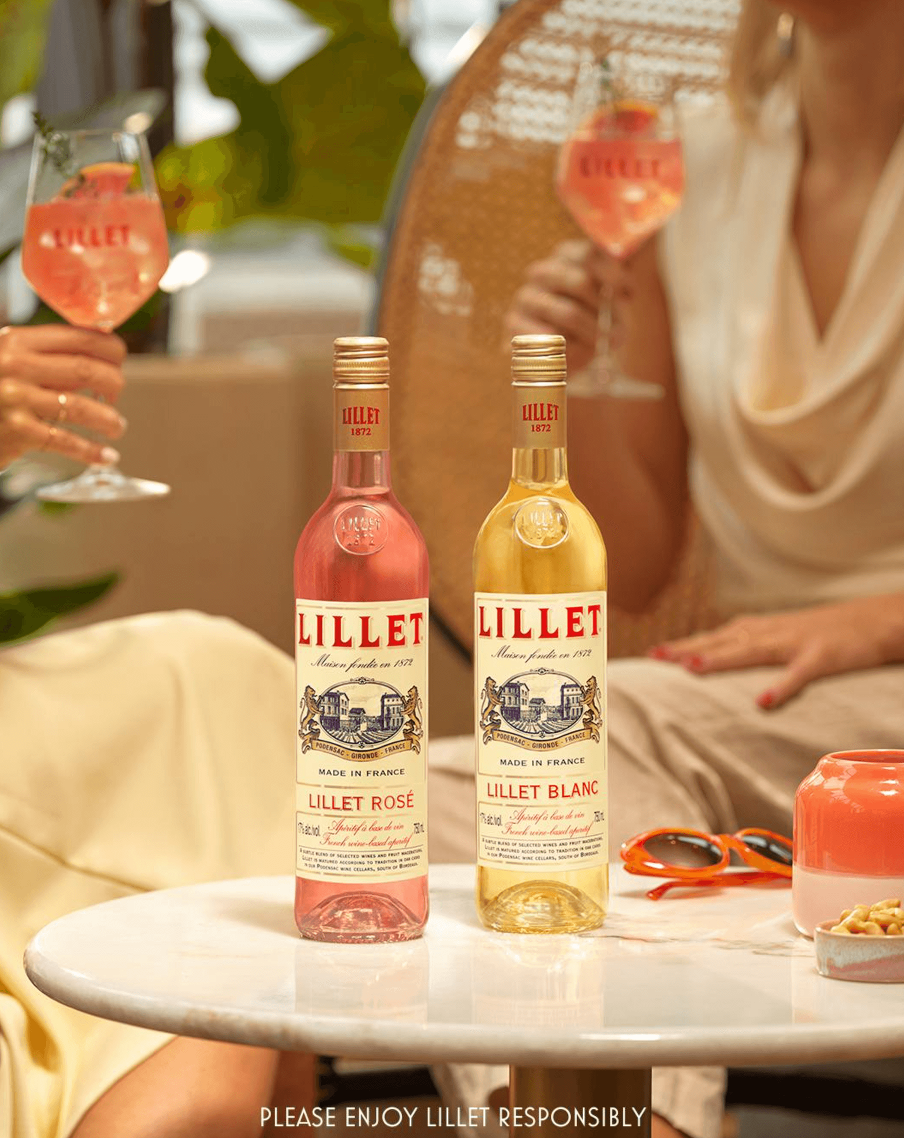 Lillet Aperitif Rosé and Blanc displayed on a table with cocktails, highlighting French elegance and taste.