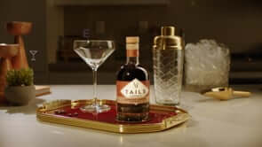 Tails Espresso Martini bottle on a stylish tray with a cocktail glass and shaker, perfect for a sophisticated drink.