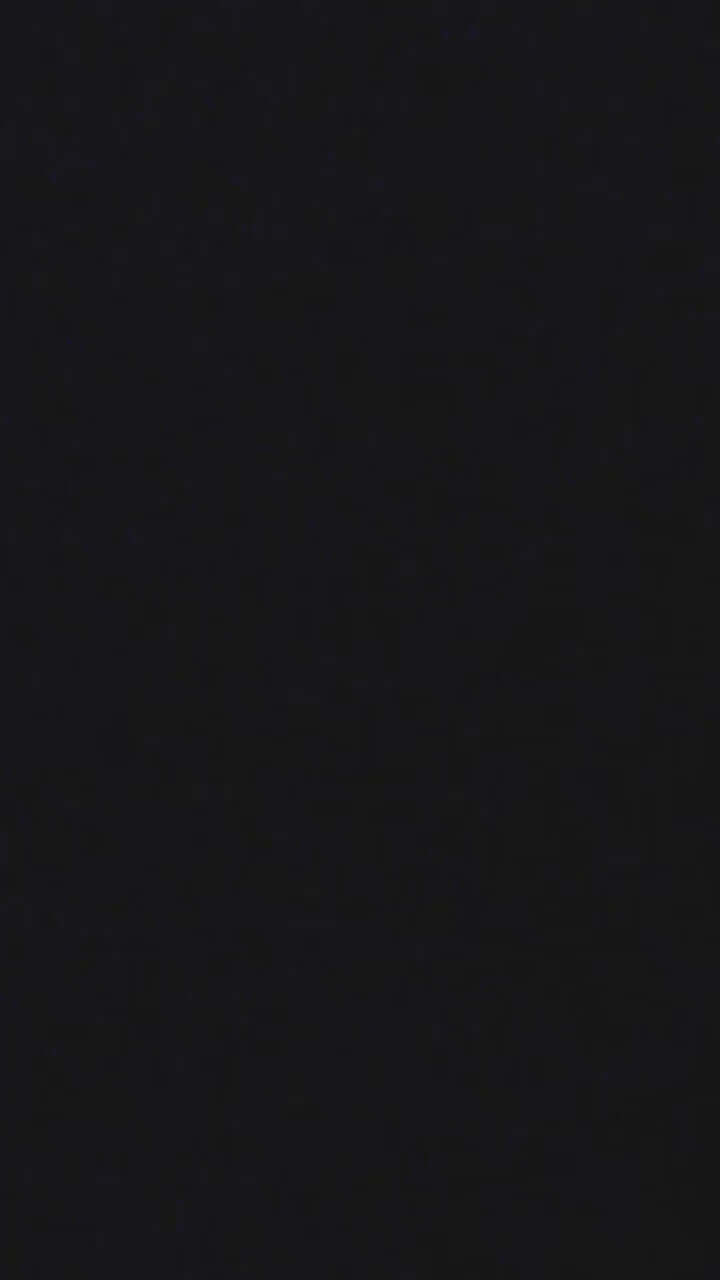 Solid black background with subtle texture, ideal for design and artistic backgrounds.