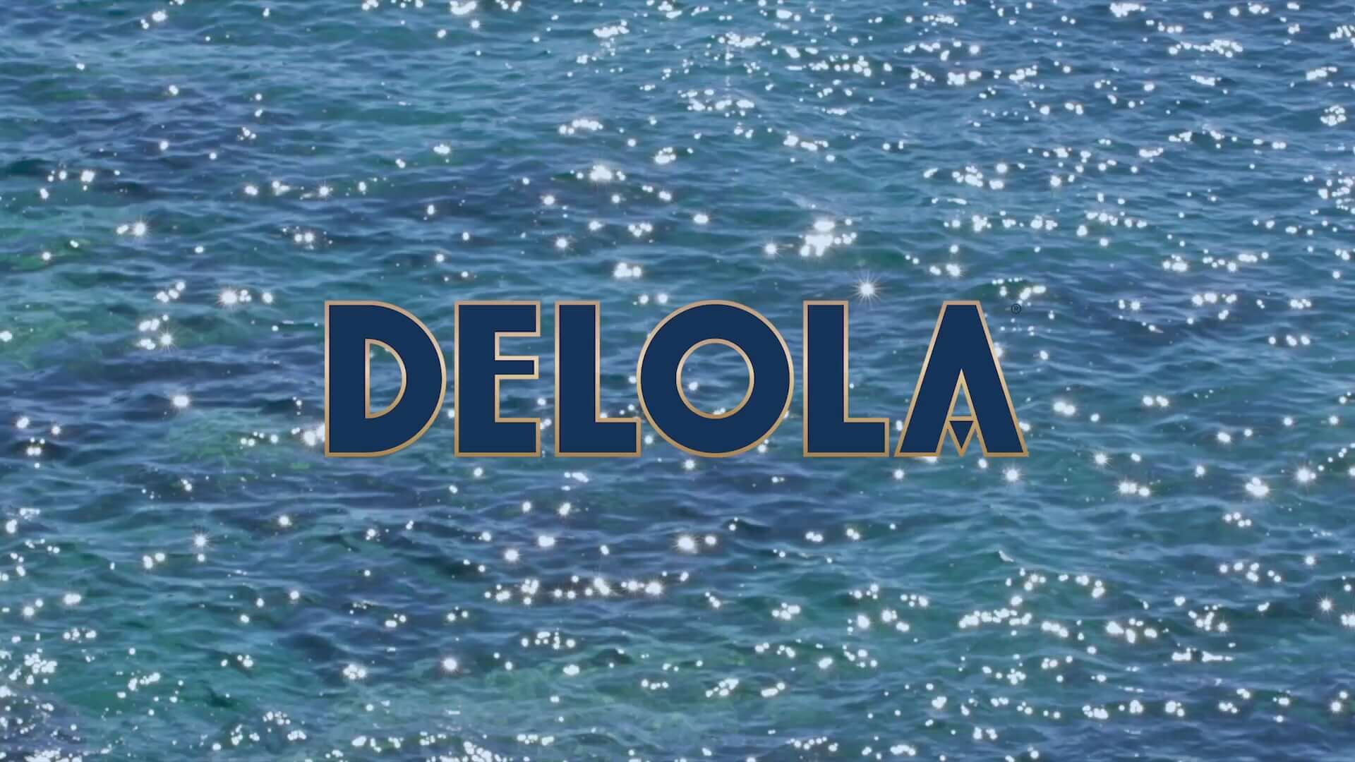 Delola brand logo over sparkling blue ocean water, symbolizing refreshing ready-to-drink spritzes.