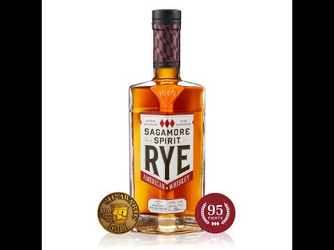 Bottle of Sagamore Spirit Signature Rye Whiskey with gold medal award and 95 points rating, showcasing its rich amber color.
