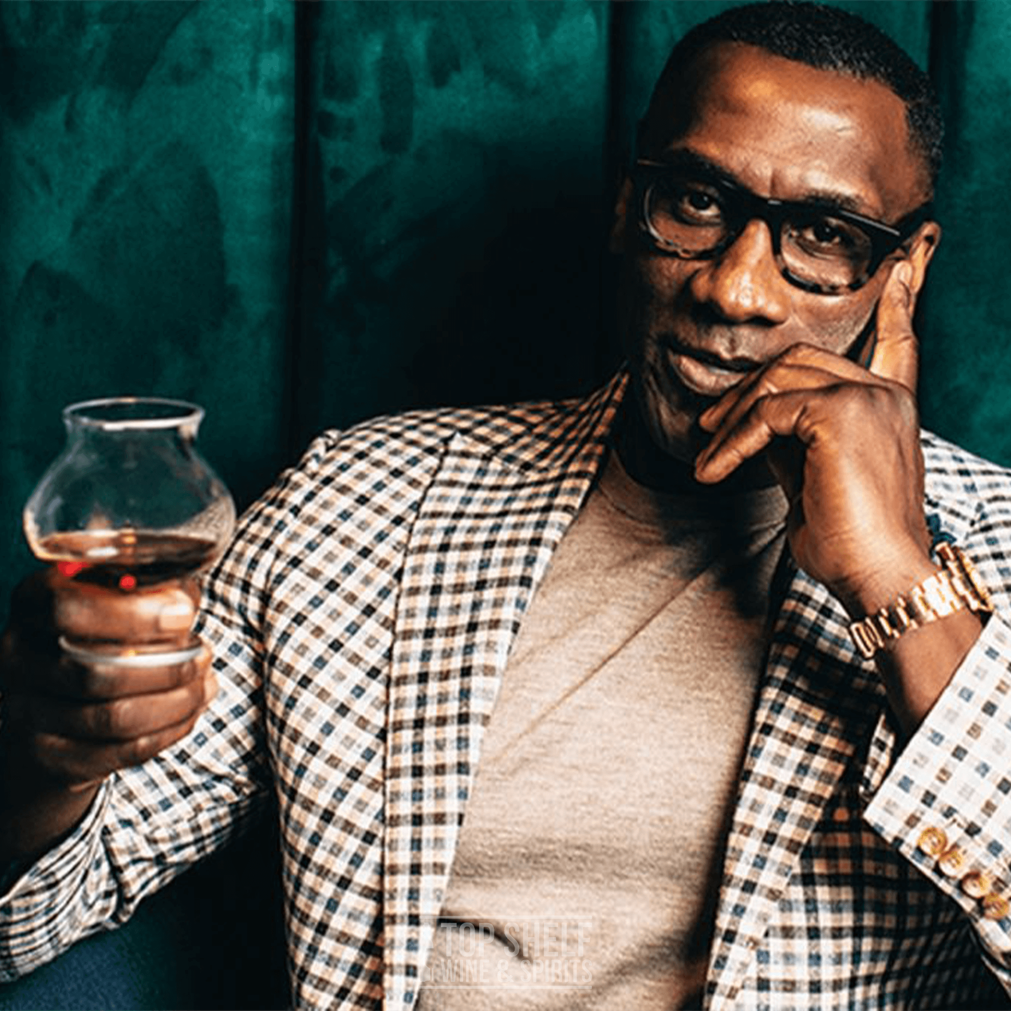 Shannon Sharpe enjoying Le Portier Shay Collector Edition 2024 VSOP Cognac in a stylish setting.