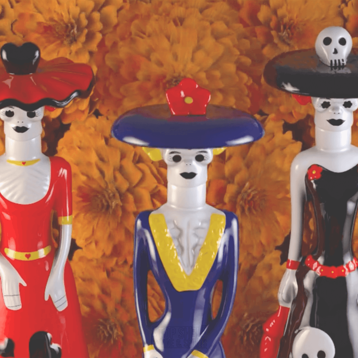 Colorful ceramic dolls inspired by Day of the Dead, featuring elegant designs for Tita Dona Celia Anejo Tequila.