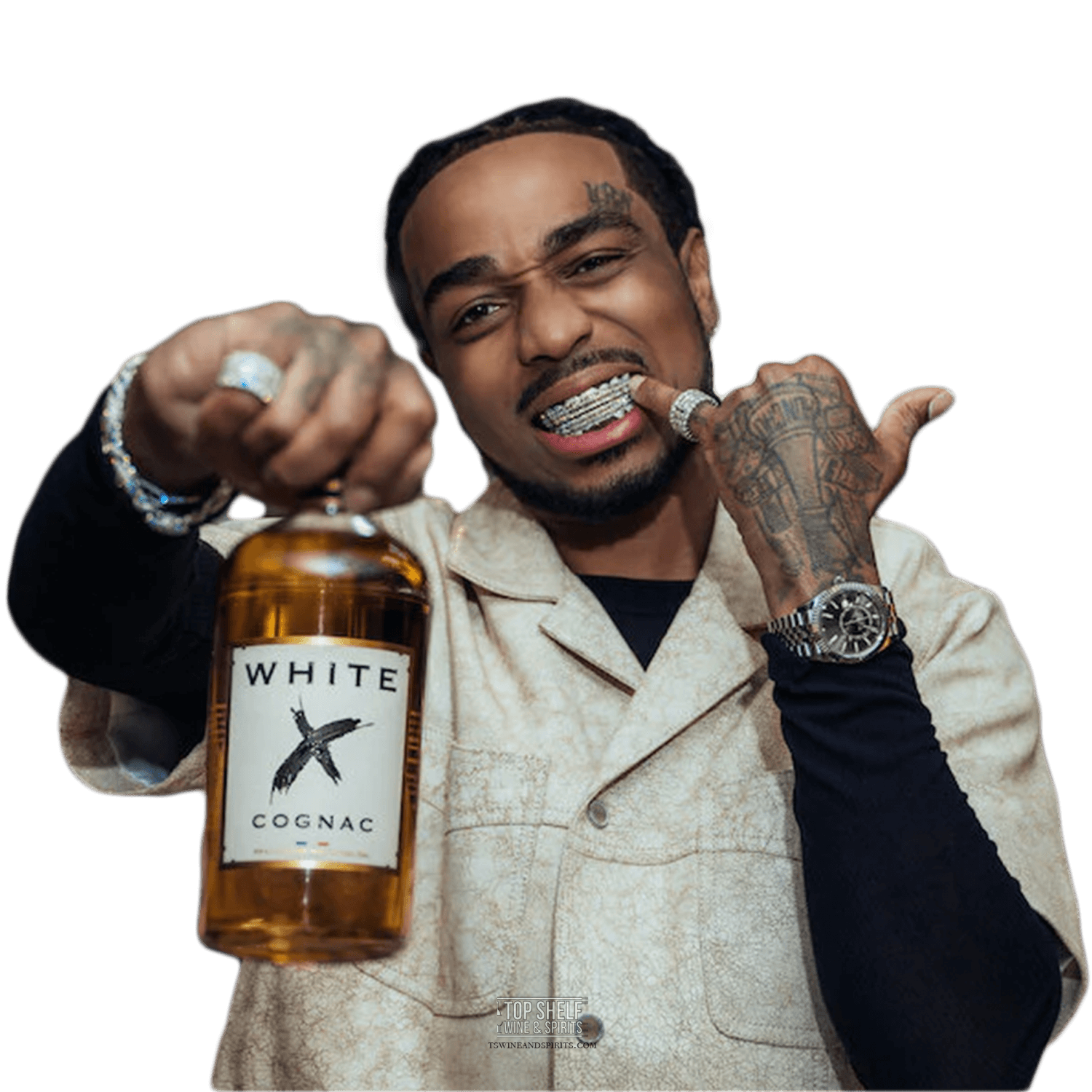 Quavo holding a bottle of White X Cognac, showcasing a modern and light spirit from Sazerac.