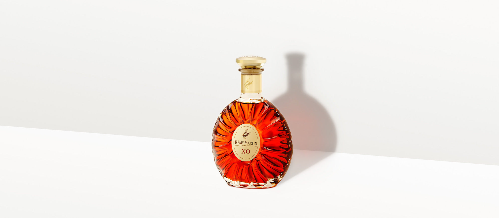 Rémy Martin XO Excellence bottle showcasing its luxurious design and rich amber color, symbolizing Fine Champagne Cognac.