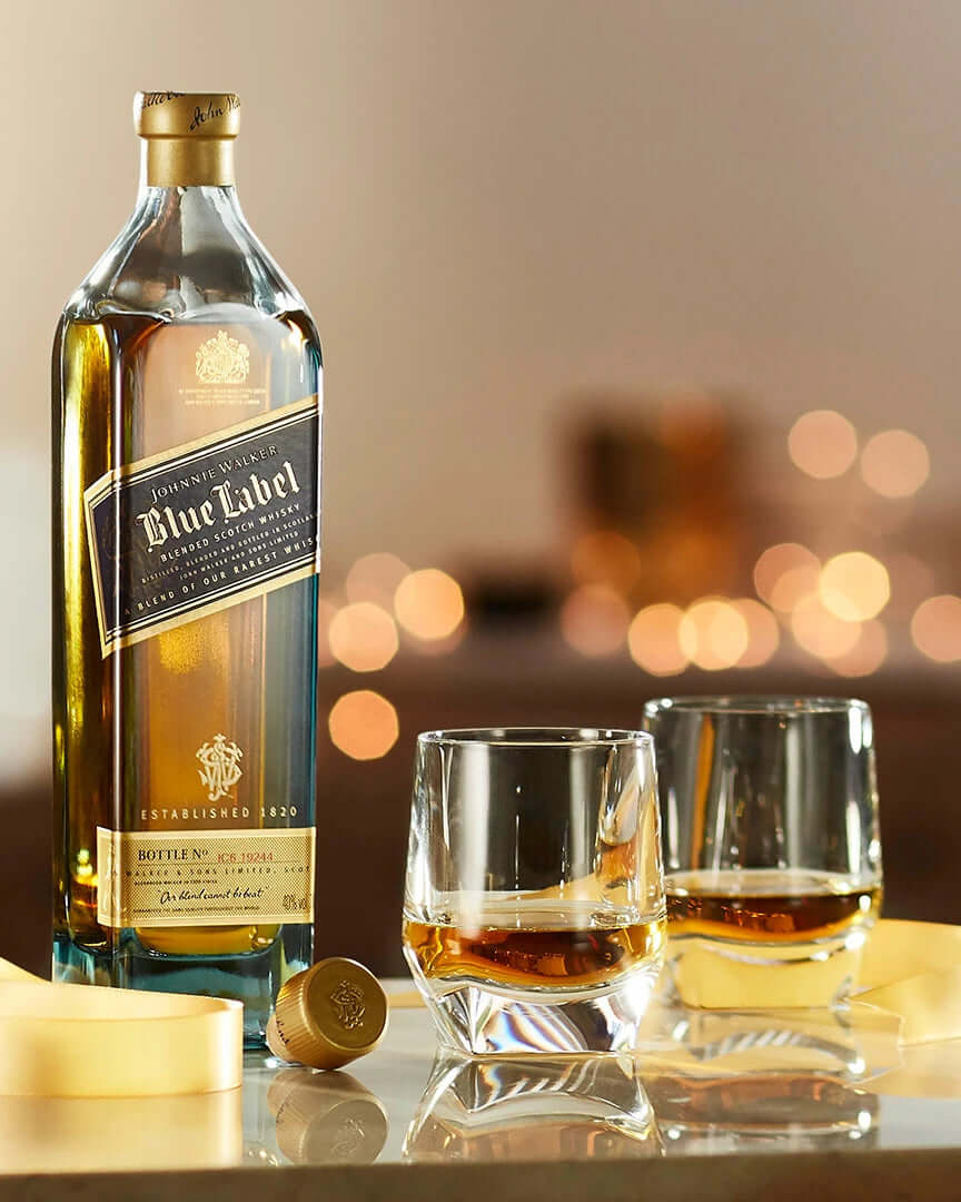 Johnnie Walker Blue Label gift set with 2 whiskey glasses and golden accents, perfect for special occasions.