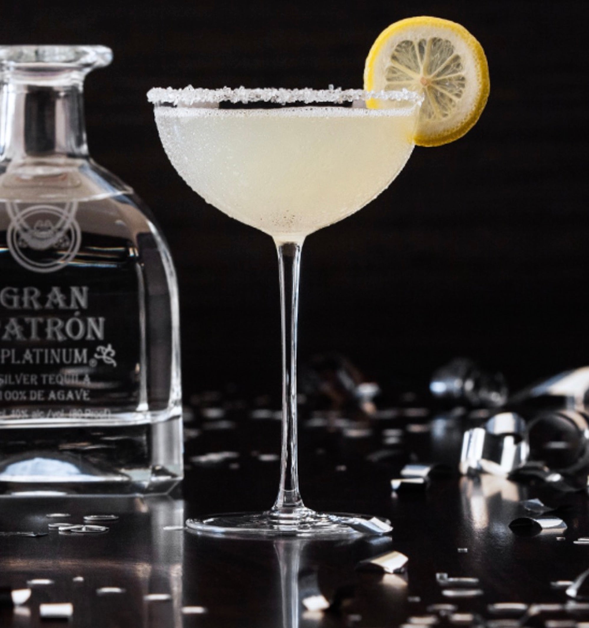A refreshing cocktail made with Gran Patrón Platinum Tequila, garnished with a lemon slice and sugar rim.