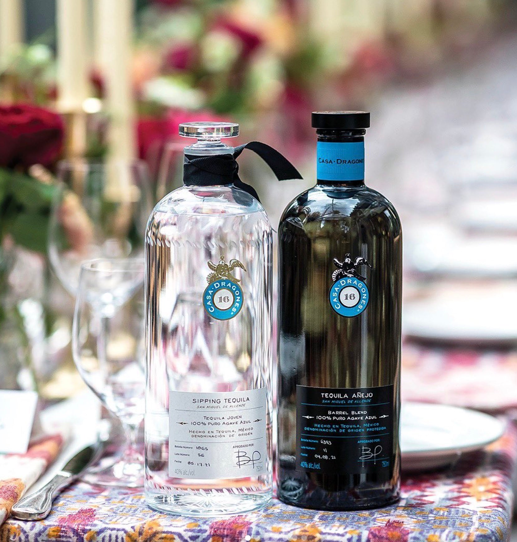 Casa Dragones Añejo Barrel Blend Tequila and Sipping Tequila showcased on a festive table setting.