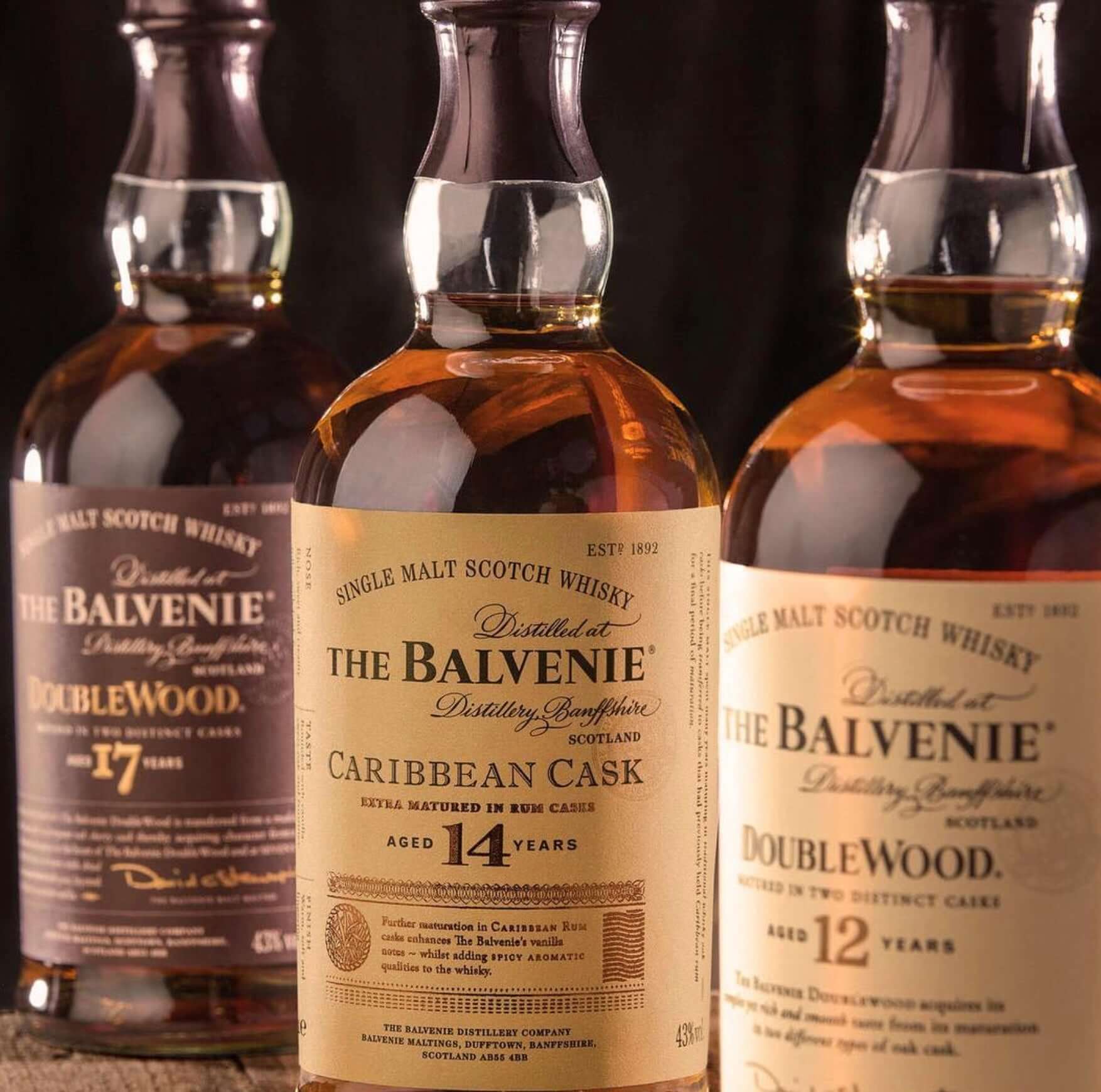 Three bottles of The Balvenie whisky: Caribbean Cask 14 Year, Doublewood 17 Year, and Doublewood 12 Year.