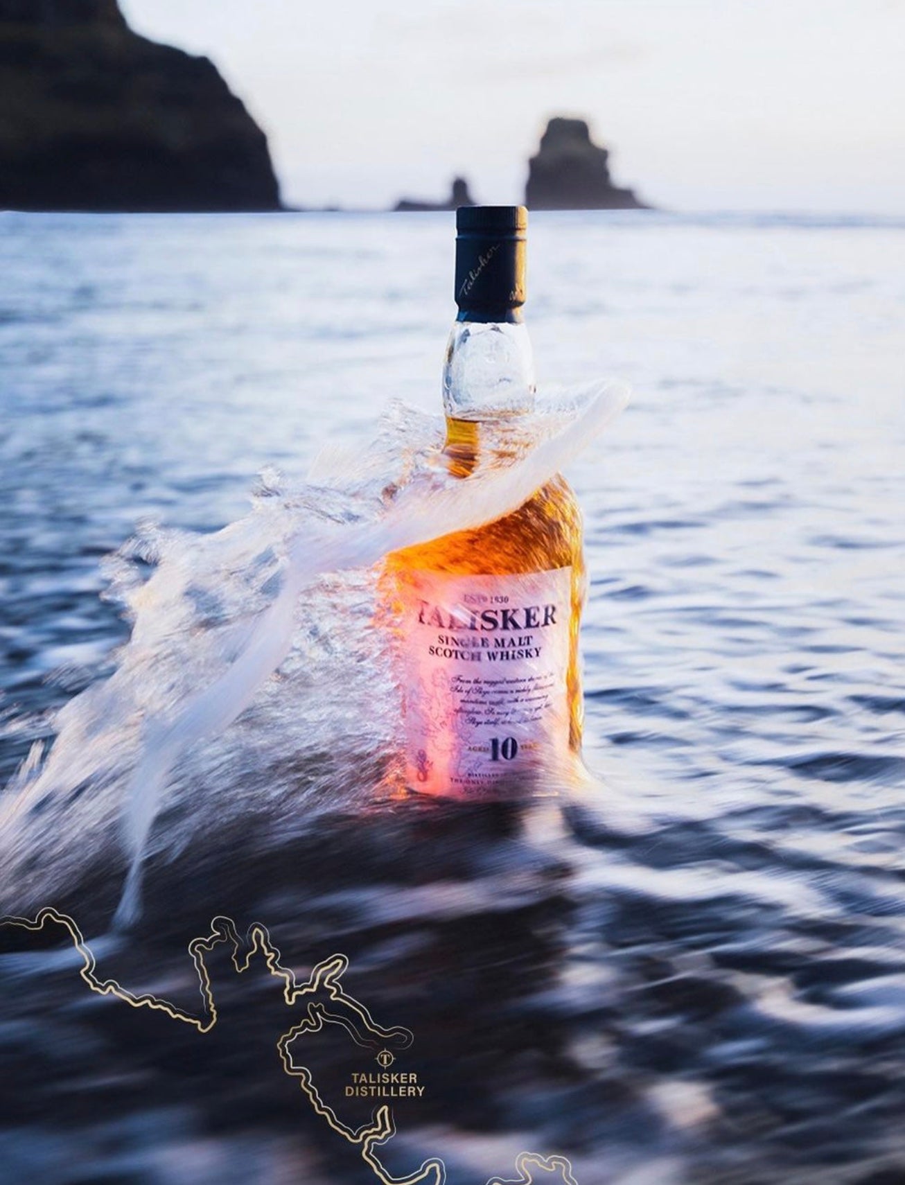 Talisker 10 Year Single Malt Scotch Whisky bottle splashing in ocean waves, highlighting its rich golden color.