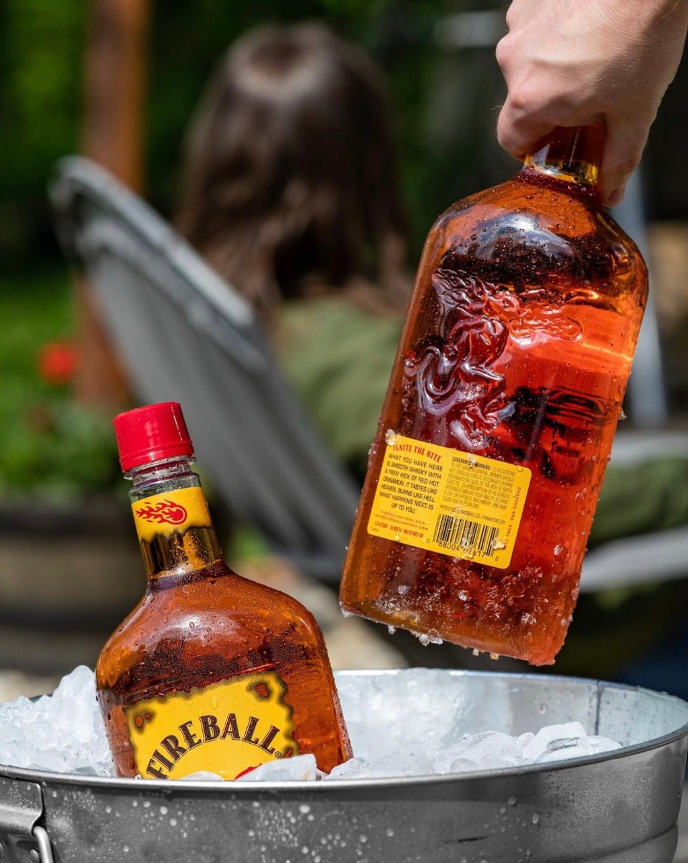 Two Fireball Cinnamon Whisky bottles in ice, ready for summer fun and parties.