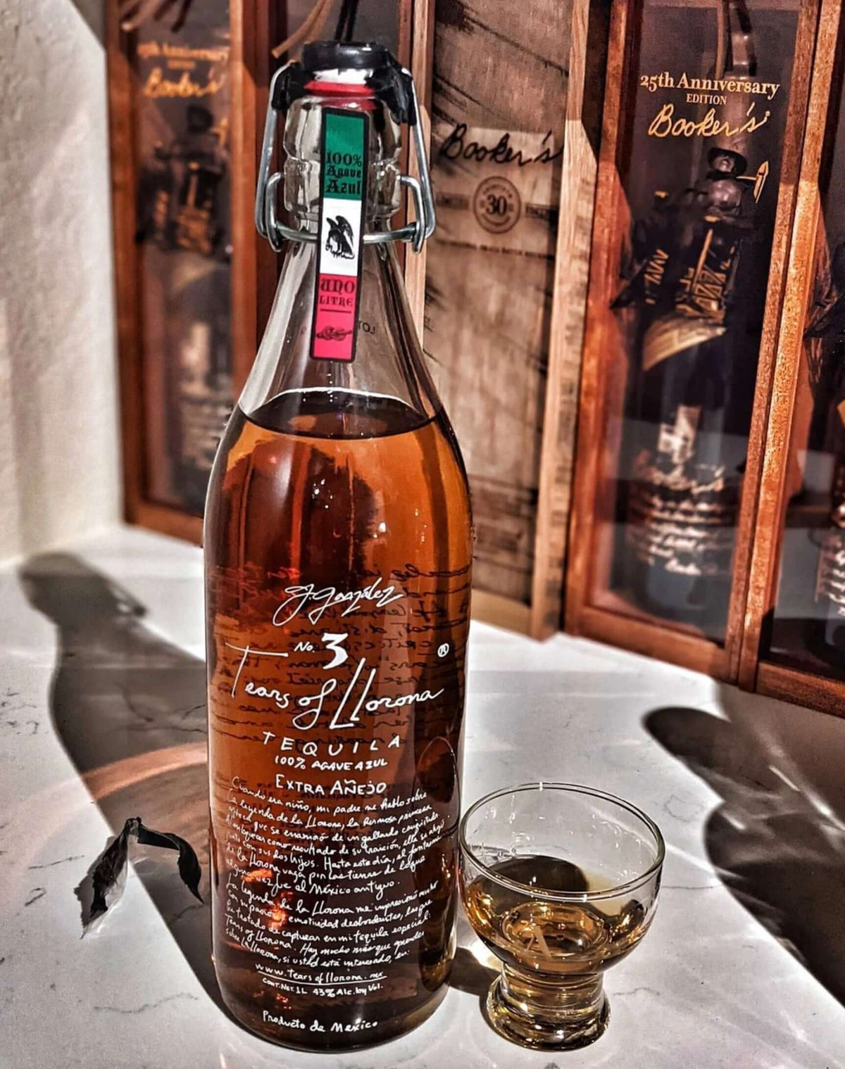 Tears of Llorona Extra Añejo Tequila bottle with a tasting glass, showcasing its deep amber color and premium packaging.