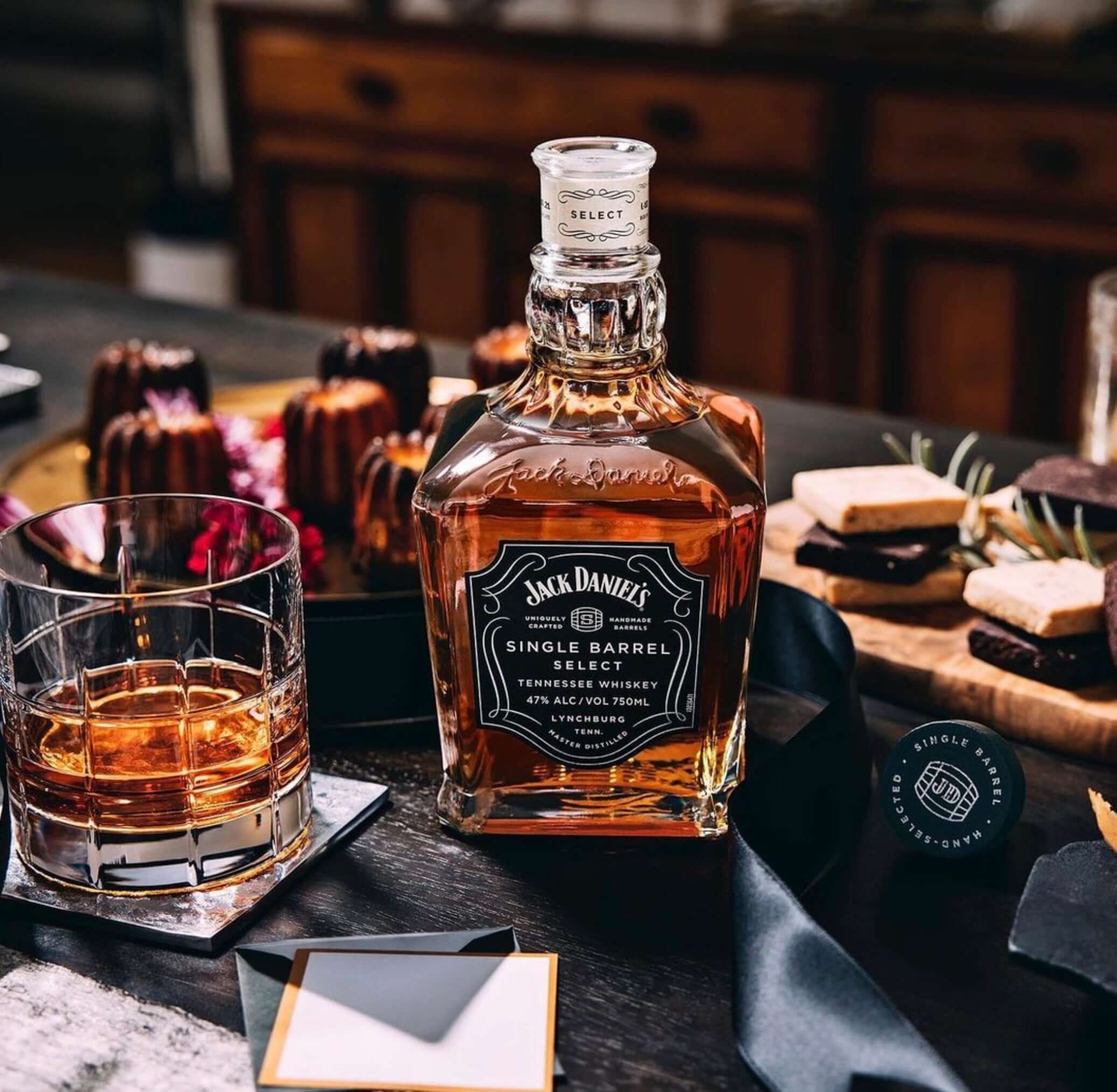 Jack Daniel's Single Barrel Select whiskey bottle featuring rich amber color, served with cocktails and desserts.