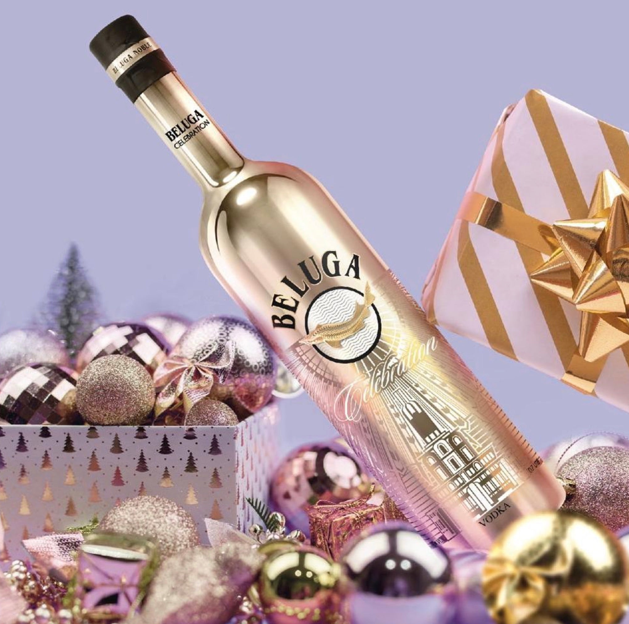 Beluga Noble Celebration Russian vodka gold bottle surrounded by festive decorations and gifts.