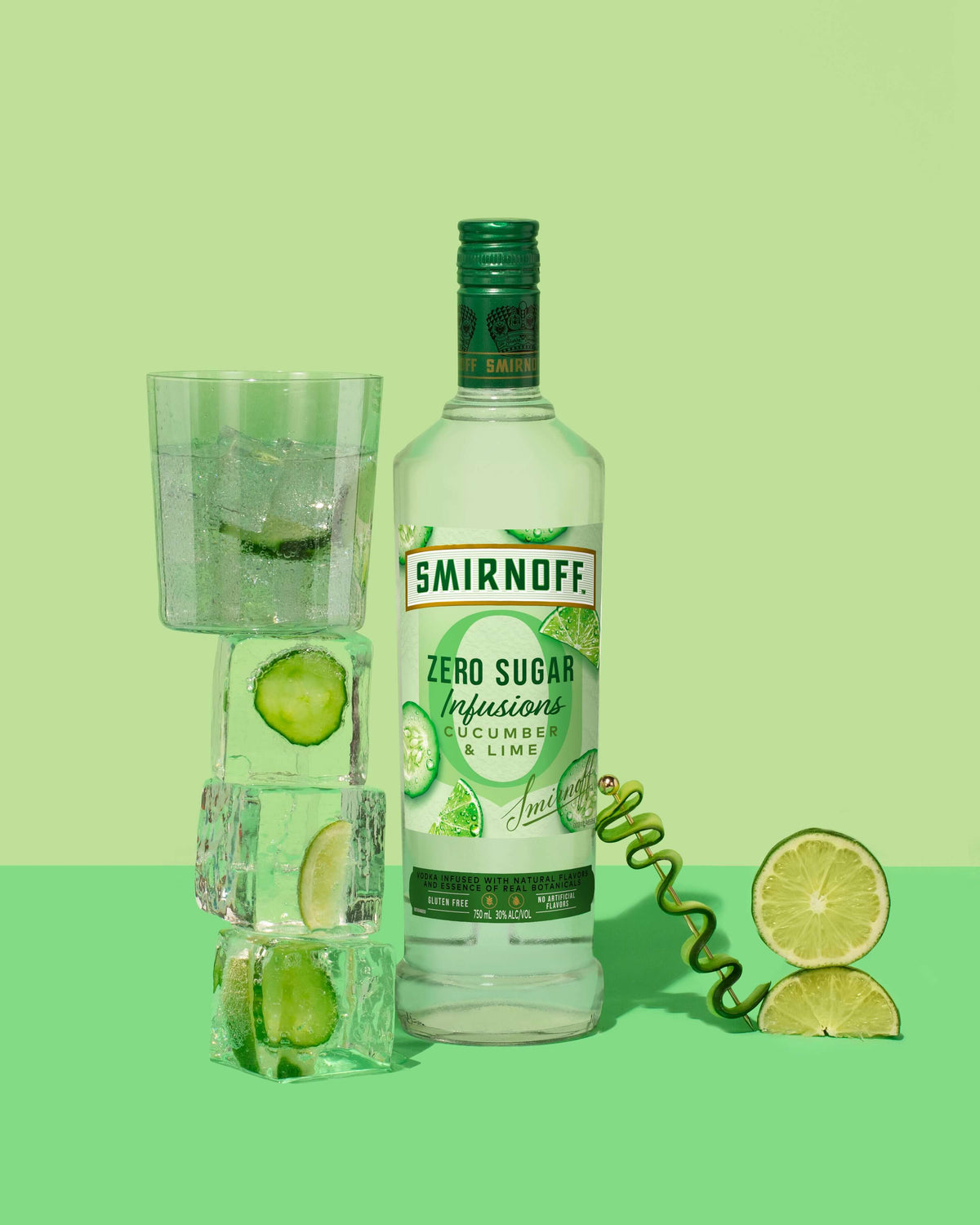 Smirnoff Zero Sugar Infusions Cucumber & Lime bottle with ice, cucumber, and lime on a green background.