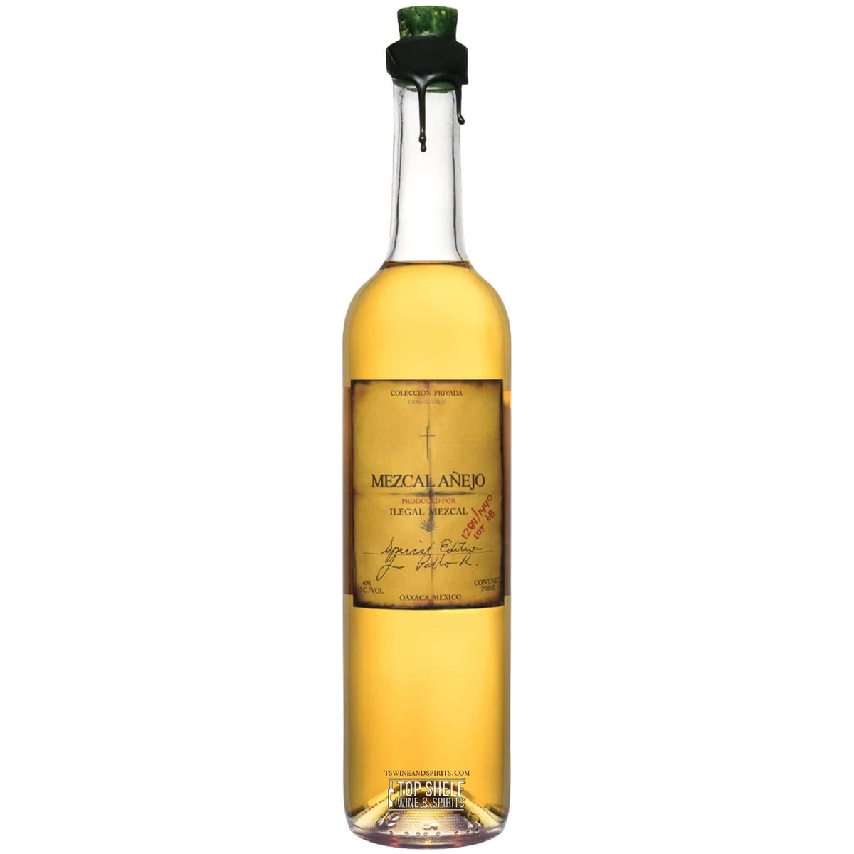 Ilegal Mezcal Añejo bottle showcasing its rich golden color and unique label, aged for 13 months in oak barrels.