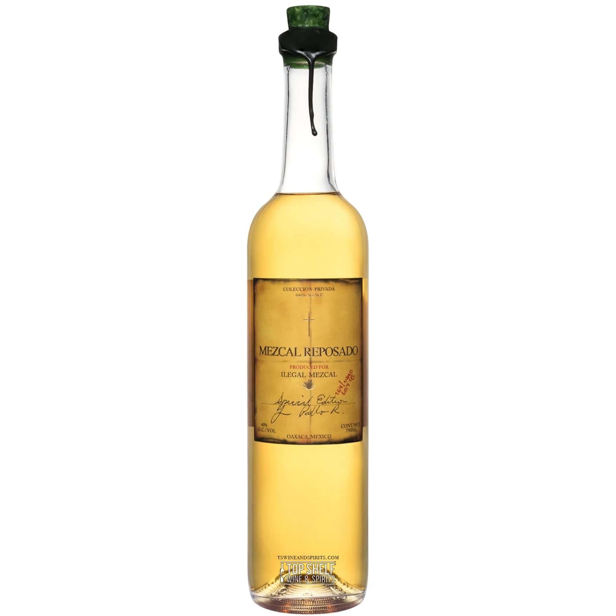Ilegal Mezcal Reposado bottle, aged four months in bourbon barrels, showcasing a golden hue and elegant label.