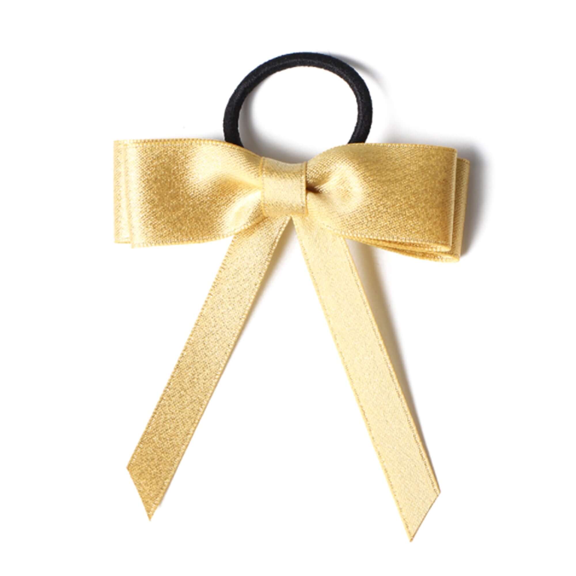Gold satin bow on a hair tie for adding a stylish touch to any outfit or accessory.